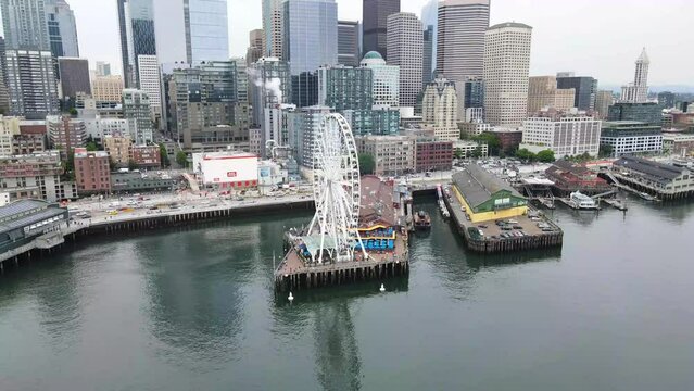 A drone fly by shot of The Great ferris Wheel in Seattle downtown, Washington, United states of America. 