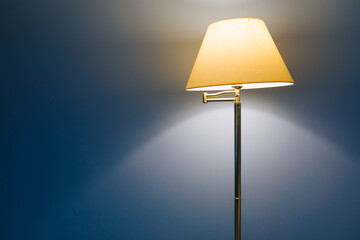 lamp light on blue background with copy-space