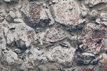 old stones wall with concrete background
