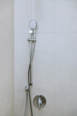 Modern bathroom with new home construction features a shower head