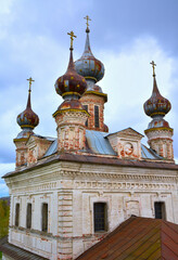 Fototapeta na wymiar Domes of the white stone cathedral