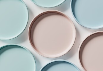 Pink, Blue, and Baby Blue pastel coloured plates on white background - Top view