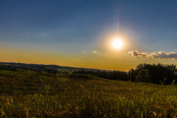 Fototapeta na wymiar Fields in a rural landscape in an early summer evening, Ohio