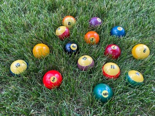 Billiard balls for American billiards on the grass.
