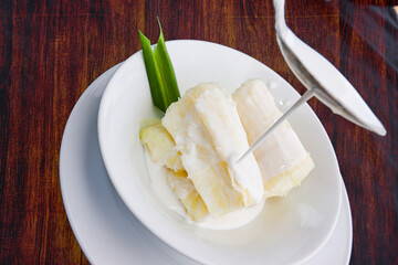 Traditional food steam thai cassava topping with coconut milk and sesame seed