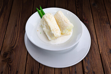 Traditional food steam thai cassava topping with coconut milk and sesame seed