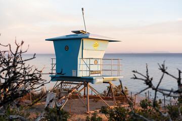 Fototapeta na wymiar A lifeguard tower at sunset in El Matador Beach, Malibu, California