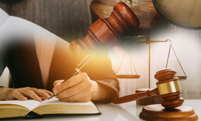 Business and lawyers discussing contract papers with brass scale on desk in office. Law, legal...
