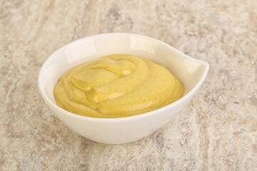 Organic mustard sauce in the bowl
