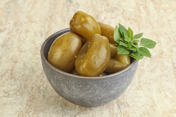 Pickled green tomato in the bowl