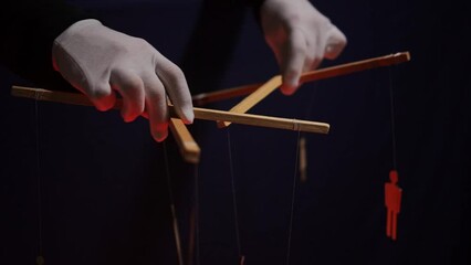 An anonymous puppeteer manipulates people. the concept of globalization