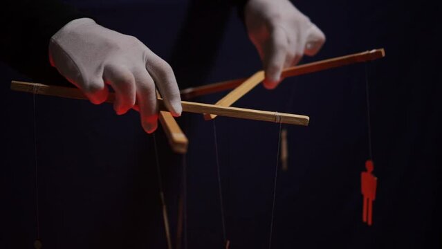 An anonymous puppeteer manipulates people. the concept of globalization