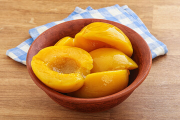 Sweet canned peaches with syrope