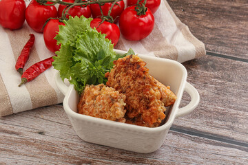Fried salmonn cutlet in the bowl