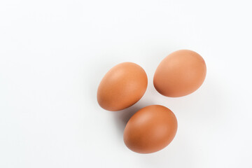 Raw organic farm eggs. Served in basket, copy space. 
