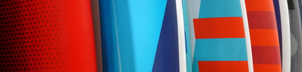 Surfboards stand in a row. Close Up View. Wide panoramic View