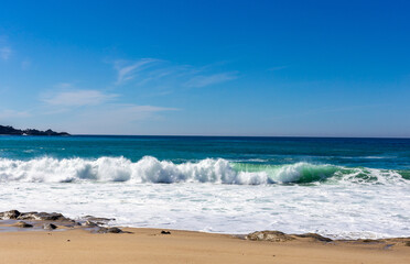 A view on Pacific ocean with blue water and waves
