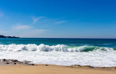 Papier peint photo Vagues de l'océan A view on Pacific ocean with blue water and waves  © Polina Korchagina