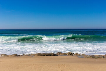A view on Pacific ocean with blue water and waves