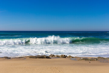 A view on Pacific ocean with blue water and waves