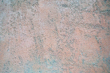 Interior background with texture of old painted pink grey concrete wall.