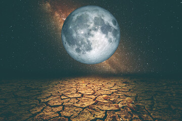 A drought-stricken area due to global warming, with the moon and stars at night.