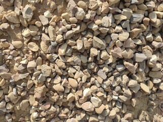 Abstract background with lot of various shape peeble stones. 