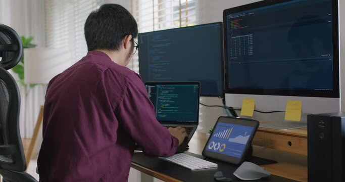 Digital transformation future workforce web DEV career development. Asia people young talent man busy work at home office reskill upskill martech job remote test on AI cloud computing cyber security.
