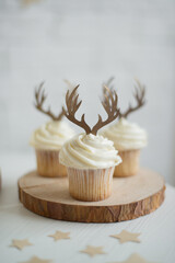 Christmas cupcake close-up decorated with deer antlers