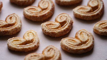 Delicious puff pastry cookies with sugar sprinkles