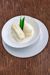 Traditional food steam thai cassava topping with coconut milk and sesame seed