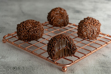 bitten Creamy Brazilian Brigadeiro, a traditional sweet from Brazil. dessert with sprinkles
