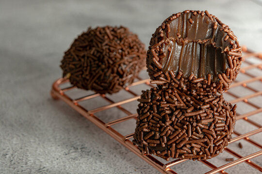 bitten Creamy Brazilian Brigadeiro, a traditional sweet from Brazil. dessert with sprinkles