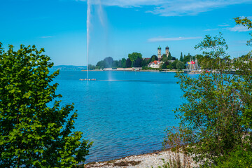 Germany, Friedrichshafen city marina at bodensee lake, houses and monastery in beautiful nature...
