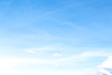 Scenic soft clouds on bright blue sky and light wind vast background