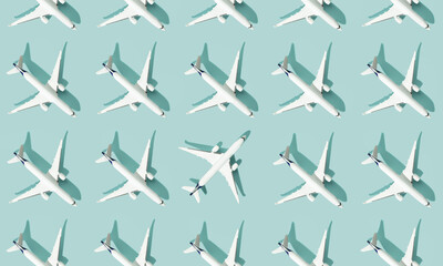 Creative composition made with passenger plane on blue background. Summer travel or vacation...