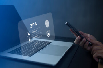 Person using laptop and touching virtual screen for two-factor authentication for safety use of...