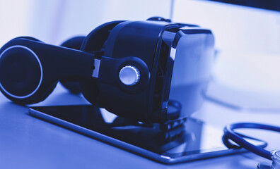 Virtual reality goggles on desk with laptop. business. 3d technology