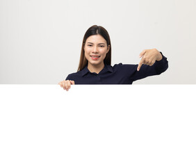 Portrait of Young beautiful mixed race woman standing and smiling on isolated white background with big mockup billboard for advertising text.