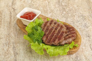 Grilled beef burger cutlet with sauce