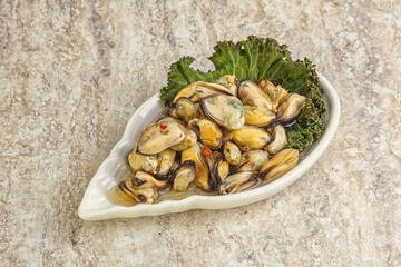 Tasty marinated mussels in the bowl