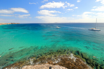 Landscape over Playa Mujeres (Mujeres beach) in Lanzarote, Canary Island, Atlantic Ocean in a sunny summer day