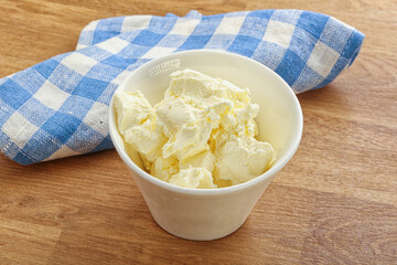 Italian soft mascarpone cheese in the bowl