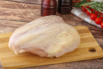 Raw chicken breast with bone