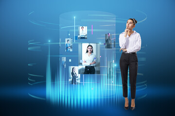 Attractive young european female standing next to abstract digital cylinder picture hologram on...