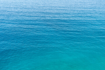 Close up photo of blue and green toned sea surface as a background.