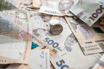 new 500 1000 Ukrainian hryvnia banknotes and coins as background