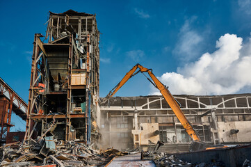 Fototapeta na wymiar Demolition of a multi-storey tower of an industrial building.