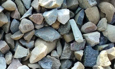 Abstract background with lot of various shape peeble stones. 