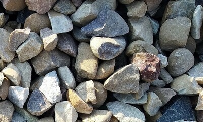 Abstract background with lot of various shape peeble stones. 